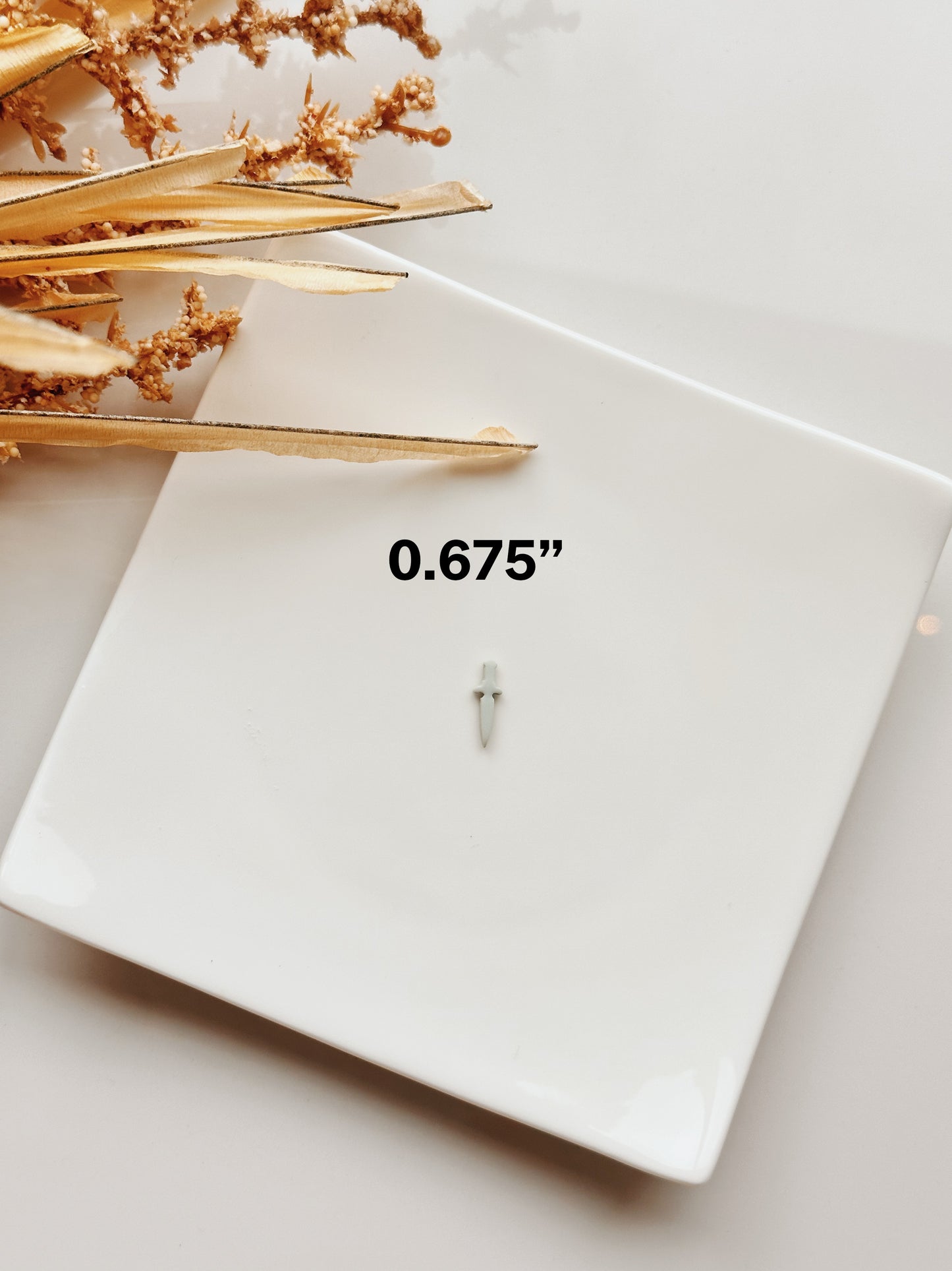 Coupe-argile en forme de petite dague