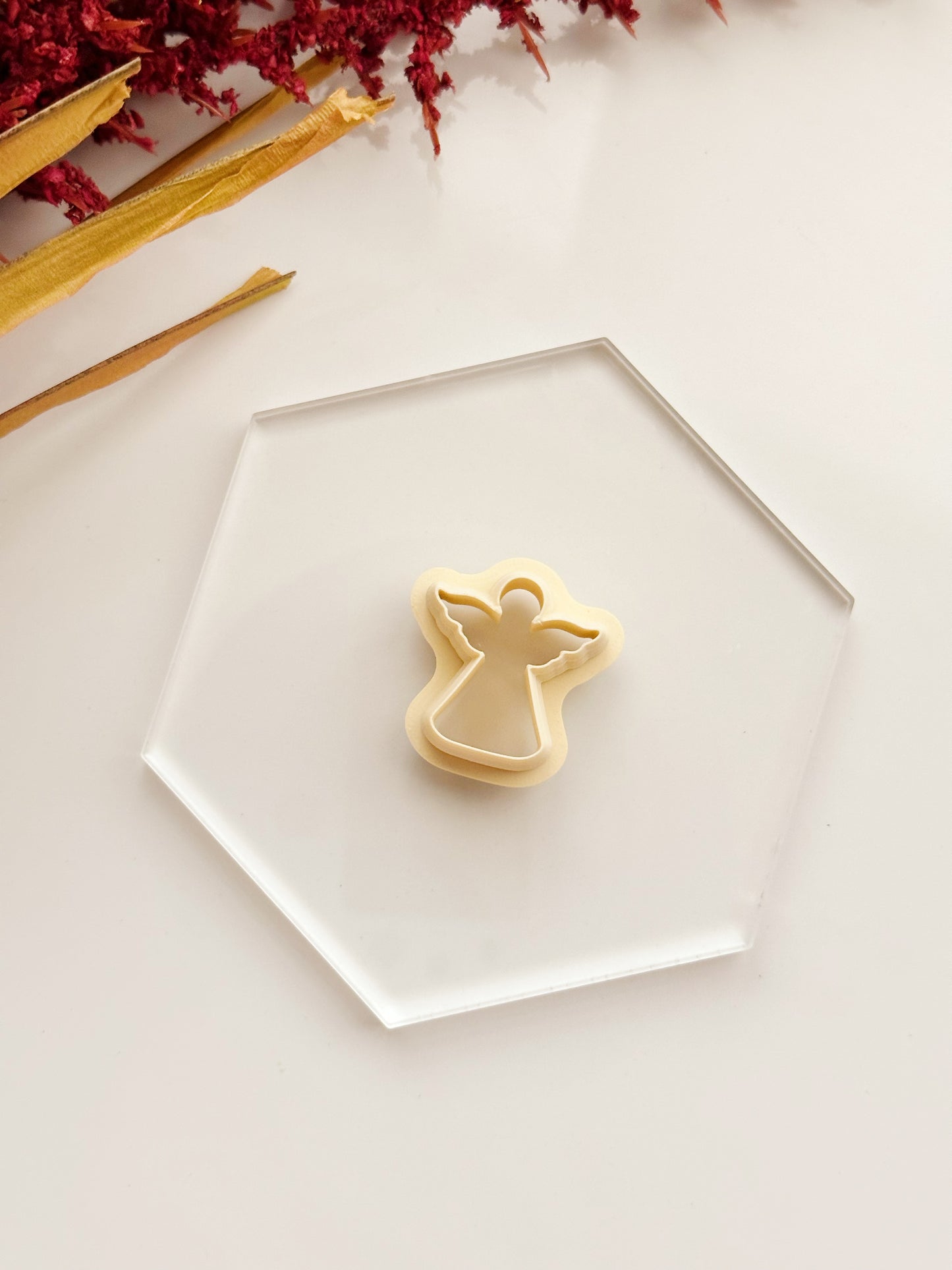 Coupe-argile en forme d'ange