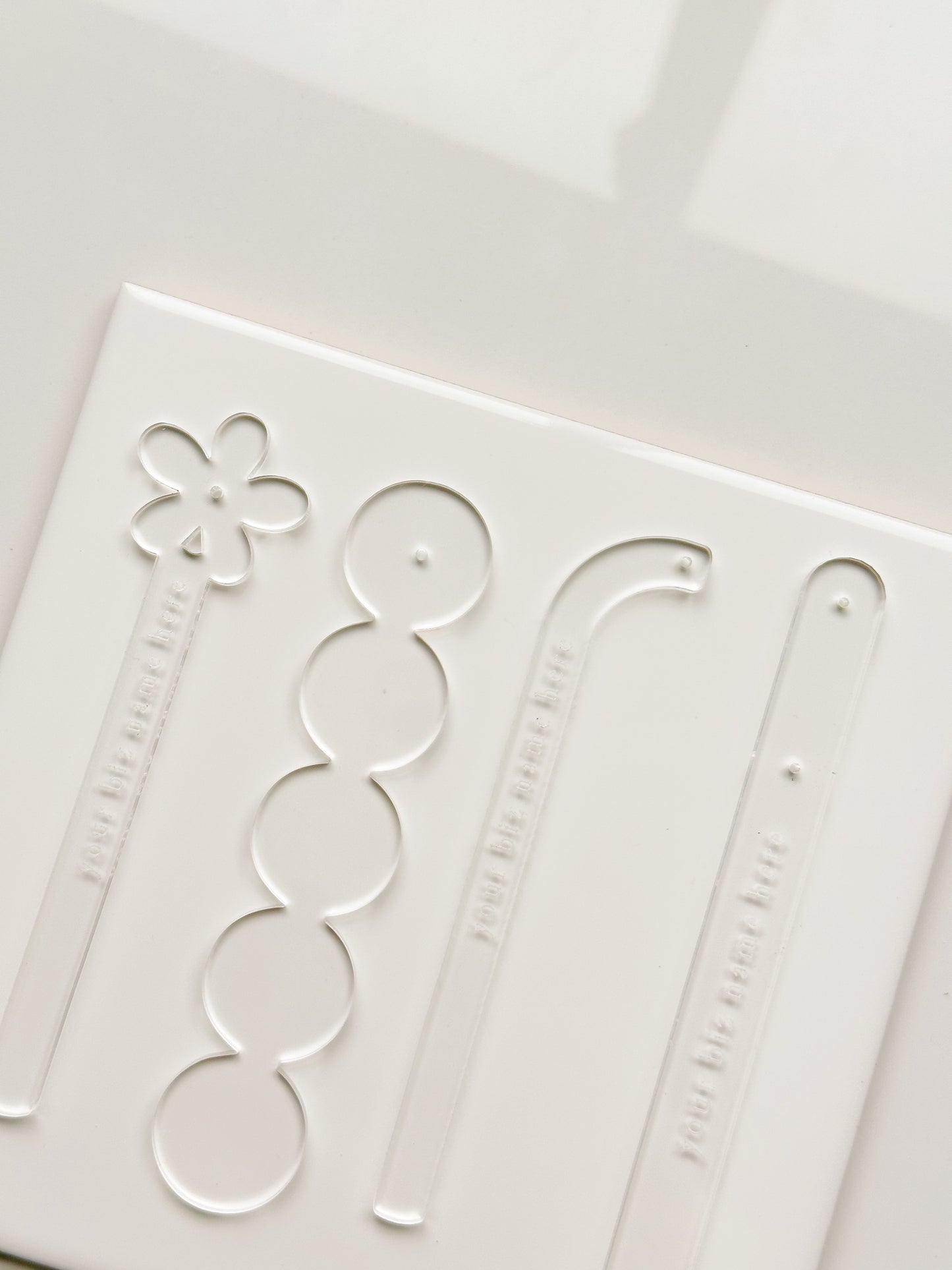 Palillos de acrílico transparente para probar aretes